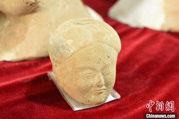 西汉陶仕女俑(俑头)。 洛阳市文物考古研究院供图 摄 西汉陶仕女俑(俑头)。 洛阳市文物考古研究院供图 摄